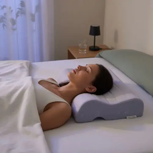 Best sleeping position for cervical spine while sleeping on back with proper pillow support

