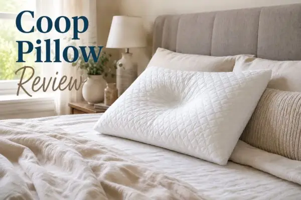 Adjustable Coop pillow on neatly made bed in natural morning light