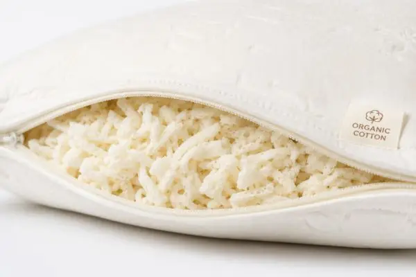 Close-up of natural latex pillow with breathable organic cotton cover for allergy sufferers

