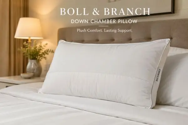 Boll & Branch Down Chamber Pillow displayed on luxury white bedding