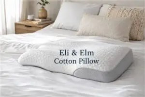 Eli & Elm Cotton Pillow displayed on modern bed showing ergonomic shape