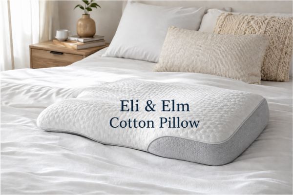 Eli & Elm Cotton Pillow displayed on modern bed showing ergonomic shape

