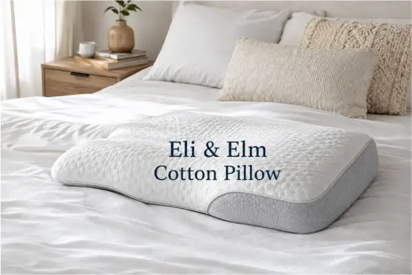 Eli & Elm Cotton Pillow displayed on modern bed showing ergonomic shape