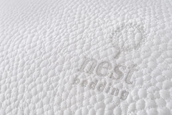 Close-up of Icecore cooling fabric cover on Nest Bedding Easy Breather pillow showing TENCEL material texture