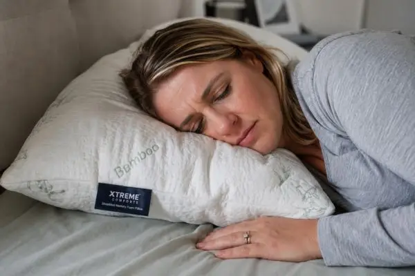 My 45-Night Reality Check: Xtreme Comforts Shredded Memory Foam Pillow – The Truth About Adjustability 7 Side sleeper on Xtreme Comforts pillow demonstrating pressure points from lumpy texture