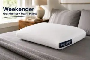 Weekender gel memory foam pillow on bed with gray sheets in modern bedroom setting