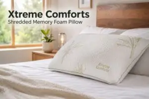 Xtreme Comforts shredded memory foam pillow with bamboo cover on bed in modern bedroom setting